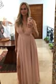 I wore this as a bridesmaid dress and loved it. It was comfortable and so much fun to dance in! I was worried about not wearing a bra but the twins stayed in place all night. It does run long but with heels it was a perfect length. I would definitely recommend this dress. - Kristina F.