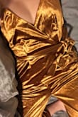 Bought this to wear for my work holiday party. I thought the shimmer tone In photos was from the natural velvet That has that shine, but it's actually Very REFLECTIVE. I would love this otherwise but it's a bit too much. Maybe nice for a darker setting with dim lighting. - Katie H.