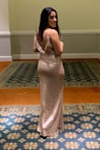 I bought the gown recently for a ball and it was gorgeous! Hugged me in all the right places. I am petite, and with that I had to have it hemmed, not an issue. The material was not itchy at all. I was super comfortable in it all night, and the price was just right. - Rocio Z.