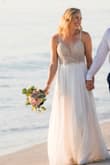 After trying on several overpriced wedding gowns in local shops, I took a chance and ordered this one when I saw it pop-up online. I'm SO GLAD I did!! It was the perfect beach wedding dress! The detailed beading and flattering fit made me feel like I was wearing a very expensive dress! Family and friends were shocked to know how little I paid for it. I had to get it professionally pressed and straps shortened but other than that it was perfect when I got it. It also delivered super quick! Highly recommend for a wedding or even a formal event. - Shana H.