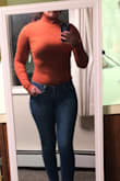 This orange is still a great color for fall but I was a little disappointed it wasn't Like the photos showing a darker rust orange. I did size up from my normal size because I anticipate it to shrink a bit due to the type of fabric. It's nice and thick and perfect for high-waisted jeans. - Kendra T.