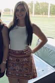 I love white shirts because you can pair them with anything! This shirt fits perfectly and you can wear a normal bra with it even with the low back. - Lauren S.