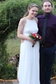 This dress was absolutely perfect for our informal backyard October wedding. The top fit perfectly, I'm tempted to wear it again with another skirt or something. The skirt fit my waist perfectly. It was a little long on me; I had to pick it up a little anywhere I walked, but that was fine. If you wore heels with it, it wouldn't be an issue. The skirt was heavier than I expected it to be; I was glad our wedding was in October because if it was hot outside I would've been sweating. Overall I loved it so much! - Jansen G.