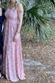 I wore this to a friends's wedding and it was very comfortable, and received compliments. I did safety pin the top to cover a little more and it was extremely long so much that even wearing heels it was laying on the ground. I should have ordered a small but overall happy with the purchase. - Erica S.