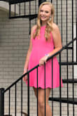 Loved this dress. The color was pretty and the straps and scallops gave it a feminine touch. It was a little loose even when tied tighter in the back. It had to be this size for the length on her. - Farrah D.