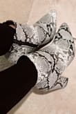 Super cute and pretty comfy too. They fit true to size. In love with these snake skin booties! Perfect to spice up any outfit! I've gotten so many compliments on them. - Jennifer L.