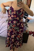 I ordered a size small and I am absolutely SWIMMING in this dress. I have a small waste but larger hips/thighs and there is no reason a small should be this loose on me. The model in the photo must be wearing an XXXS to fit like that. Unfortunately, I bought this one on sale so no returns/exchanges. Very disappointed in the sizing guide. - Elle U.