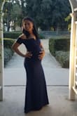 The fit was perfect for my six month bump. I wore this for a wedding and received many compliments. For reference I purchased my regular size S and it had the perfect amount of stretch. I would recommend this dress 100% - Dina M.