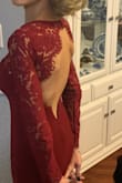Wore this for a black tie Christmas gala.  It was a showstopper.  The front is very pretty and dare I say, quite demure.  However, the backless back.... holy wowzers!  I felt amazing and was actually quite comfortable as the dress stretched and moved with me.  Also, by the end of the night, the metal piece in the back did get uncomfortable but not anything that would prevent me from wearing again.   Also, you could remove it like other reviewers did. - Amy P.