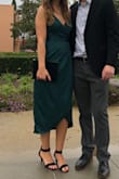 This dress is great. Good quality for the price, and I LOVED the color. Definitely got some compliments. Its more of a blue green than a true green. I wore it to a winter wedding and danced all night. It's a great length and pretty comfortable! You can wear the bow/sash on the side or in the back. I did it in the back, classic and pretty. - Shanae P.