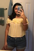 I really loved this top, especially because of the bright color and the style. One thing I didn't like about it was that it really rides up on your shoulders and does not stay put. Besides that, its super cute and comfortable! It fit really well and is nice and flowy. - Juliana E.