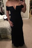 This dress is to DIE for! I ordered it along with a few other options for my fiancé's holiday party. It was almost the winning style but I went with something a little less formal and had to return it because I could only afford to keep one dress. The weight of the fabric is perfect and would definitely keep you warm but wouldn't be too hot. The cleavage was definitely there but not so there that I would feel self conscious wearing it to a company holiday party. The arm bands did a really nice job of keeping the dress up even after I did a few test skips through my apartment. 
TLDR: I would have kept this dress but it was a little too formal for the event I wanted to wear it to. - Taylor S.