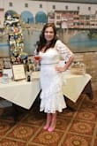I wore this dress for my bridal shower & received so many compliments! I normally wear a medium but thankfully ordered a large to be on the safe side. It fit like a glove! It accidents all the right features and was truly the perfect dress for my perfect day! - Allison D.
