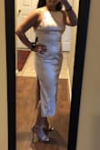 Love the fit. Due to the material, it's hard to find undergarments that won't show through but it's not impossible. The straps are adjustable so you can manage how high or low the top of the dress sits on your collar/chest. The color is more of a champagne, slightly pink. I wouldn't consider it ivory/cream. - Denisse V.