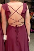 The material flows nicely. Looks amazing on. Love the ruffle straps. - Janine W.
