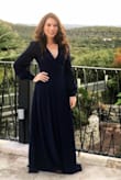 I wore this to a very chilly November wedding (40 degrees), and it was the perfect choice. Warm enough with the full skirt for the outdoor ceremony. Cool enough with the sheer sleeves for plenty of dancing during the indoor reception. It was appropriate and classy, and I received so many compliments. I chose "A little large" because I had to tie it tight on the top since I have a small bust, but I really like how the dress can be tied as loosely or tightly as you wish. It's truly perfect for all body types. I would not size down because the shoulders hit  right where they should. As for the length, I wore cowboy boots with a short 1.5" heel, and the dress just grazed the floor as I walked. Loved it! Highly recommend! - Damiana P.