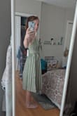 Absolutely love this dress! The material feels really sturdy and the bow and keyhole opening in the front are adorable. I need to iron/steam the wrinkles out of the skirt but I can't wait to wear this dress. I ordered the xs (5'3" 107lbs) and it fits great around my ribcage/waist. I'm short so I'm going to wear a taller heel with it because midis are always a little longer on me. - Julie L.