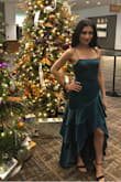 I love everything about this dress. The shape and fabric is stunning. However, I bought an XS cause I read that it runs big, and STILL had to take it to the tailor. Fits like a glove now. I wore it to a company Christmas dinner and got so many compliments. I'm going to wear it again for my Christmas recital. It think it's worth the buy, despite the sizing issue. - Andrea M.