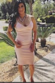I wore this dress to a summertime wedding. It went perfectly with the suede pink heels that I purchased for it. I was comfortable in it even though it is form fitting and accentuates curves. I didn't think that it was too revealing for me. - IKSSA A.