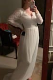 I couldn't have been happier with this dress. I felt beautiful on my wedding day and sexy in the back!!! I had to have the sleeves taken in and the length come up but it was perfect. My wedding photographer actually lost all of my wedding photos so I don't have a great picture of the dress. - Nicole L.