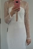 The dress did not fit well. It was much longer on me than on the model and had more of a tube fit. This shade of white looked very pale on me. Made me think of the Corpse Bride... - Tatiana G.