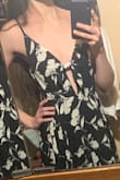 The dress is super cute and flowy, and fitted at the top. It also has two layers in the skirt area so if it's windy the fitted part stays and you don't pull a Marilyn Monroe. I bought the black and white one. Although the b/w dress picture doesn't have the gape, the actual dress has one like the picture of the yellow dress, but I was expecting/hoping for that. I bought it for a destination wedding in a warm climate. It's perfect for that because it's long enough to wear formally but short enough to be cute. It's probably 3-4 fingers above my knee. I like that I can adjust the tie and the straps. Overall really happy. Can wear without a bra if you have small/medium breast size. - Reane V.