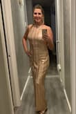 The dress was beautiful and comfortable. 
I got a ton of compliments. It does run a little big but I opted to keep the medium and alter it. - Rachael C.