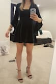 Really nice material and thicker than I was expecting. Runs a bit large as the model is wearing an extra small and waist shows to be 24". My waist is 28.5" but the xs fit (snug but comfortable. Too much cleavage for my bust (34D) so would have to wear something under and not a huge fan of how that looks (like the normal neckline by itself better... if there wasn't so much cleavage for me). The other issue is how short this dress was on me. I'm 5'8 and it came up to my mid -upper thigh. Not great for moving around and dancing because any movement, the bottom of my butt would be very close to showing. Because of how short it is, it looks similar to a figure skater dress. I would recommend this dress if you're average to short height. - Sabrina G.