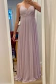 Purchased this as a bridesmaid dress for a wedding in 7 months and already can't wait to wear it! It fits perfectly aside from being *slightly* loose in the bust, but full disclaimer - I tried it on without a bra. It's definitely really long; I bet I could get away with wearing 4 inch heels, but since the bride wants us in cowgirl boots, a hem will be necessary. Better that than too short though! Overall I LOVE the color and the way it wears. I'm a curvy girl and it's pretty flattering. Looking forward to wearing! - Asia F.