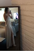 I wore this dress as a bridesmaid in a friend's wedding and it was beautiful. It's such a flattering piece with the slit on the leg and the deep v neckline. The quality of the dress is really nice and it was comfortable to dance in all night long. It's definitely a great dress for special occasions! - Gabby D.