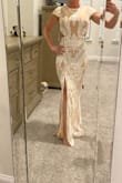 This dress is exactly what I thought it would be and even more beautiful on! It fit perfect and is such a great quality. It is too long for me I will need to get it hemmed, but it is perfect for my wedding rehearsal and dinner. - Julie B.