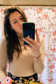 I loved this shirt. I was worried because I am usually a medium, but really wanted this shirt for Thanksgiving to get the full outfit. I ordered a small and it fit perfectly. Stretchy and snug. A little short but the skirt was high waisted so it was fine! Definitely recommend. - Meghan M.