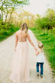 This dress was perfect for family photos. I ordered a small and it fit perfect other than it was a bit long. I had a few inches taken off the bottom but being a shorter individual I expected that. Since the back is laced there's a lot of opportunity to make it looser or tighter around bust size. I washed my in the washing machine after getting covered in mud at our photo shoot and it cleaned easily. - Alyssa M.