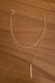 I caught this on sale on black friday (deeply discounted), it's a great versatile necklace that goes with just about anything! True to picture. The choker layer does kind of flip around/kind of hard to get the dangly pieces to all face down, but considering I paid like $2 for it. - Ra S.