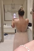 I was really nervous about this dress being final sale. I read the other reviews and prayed it would work. I'm a bridesmaid in a wedding in Maui and her color is blush but she loves sparkles...so this fit the bill. It truly is stunning in person. This pic is in bad lighting, with no bra or spray tan and I still think it looks great! I liked the cups and will buy a sticky bra to help with support. - Kim G.