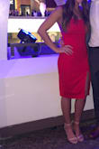 Pretty red dress! It is well made with quality material and hugs in the right places. However, the bust area runs a little large, but a strapless bra may help. I am pretty tall and it went down to the middle of my knees and the slit goes to about the mid upper thigh area. I wore it to a holiday work party and received a lot of compliments. - Meghan M.