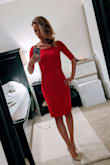 First - this is a perfect, deep red. There are no brown, orange, or purple tones to it. Second, the fit was excellent! It could've been custom, given the dimensions across the shoulders, the skirt length, the sleeves, etc. No modifications needed. Because it's super tight *and* such a statement color, I'd recommend it for a fancy holiday or cocktail party, but probably less appropriate for something like a wedding. It is obviously not at all subtle, so if you're not looking to draw attention, pick something else.

I wanted to wear a strapless bra and shape wear, but it was too tight for that (the bra band and shape wear looked obvious and lumpy) so I went without either and it was a great call. - Lauren C.