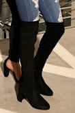 I have been searching for a pair of over the knee boots that actually stay up (tried the tying kind and those still seem to slip down). I have pretty skinny/dancer's legs and I am so so happy I found these because they stay up!!!!! I've only had to pull them up a couple of times but that's after I've been walking in them for over an hour or so. Super comfy and super cute. Highly recommend!! - Meghana P.