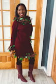 I bought this sweater dress for 'ugly sweater' day at the office. I bought some decor from the dollar store and used safety pins to hold everything together without destroying the dress.
Everything turned out perfect! The dress fit perfectly and hugged my curves and showed off my booty. It was neither tighter nor loose on my body. It was just right! I have very big boobs and a bit of a tummy since I do have twins. The dress made my tummy look small.
I'm rocking this dress with black tights and Marc Fisher red/burgundy boots. - Sophia R.