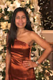I wore this dress for a holiday get together with my friends and it's super cute. I like the material of the dress and the bronze color is exactly what I was looking for. However, the dress is a little big on the chest area for a woman like me who is a 32DD and the one shoulder strap is long for a 5'2" tall woman. I tried getting it altered but the tailor wanted $50 to get it fixed. I ended up using a safety pin on the shoulder area to pull it up so my breast wouldn't be showing. - Theresa B.