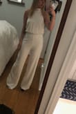 Got this for my rehearsal dinner. Definitely needs to be hemmed, but fits great!! The fabric is forgiving, which is nice! Wasn't expecting that for white. - Kelsey M.