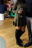 I wore this dress in the winter with knee high boots. It was so comfortable. It fits perfectly from the bust and arms and is looser from the middle, down. Love this dress, highly recommend. - Prabh T.