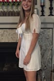 Loose a little in the sleeves . Ordered a small in white and a medium in this one love both. Here's a picture of the white one - Kristen L.