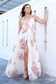 I bought this dress for my engagement shoot in Mexico. The material is a little heavy and is lined, so as beautiful as it looked, I was sweating up a storm, so maybe not the best choice for 85 degree humid weather! It's a wrap dress so there's a lot of room to adjust to your size. I have a very boxy waist so I liked having this style of dress. The print is beautiful and the movement of the dress was really fun. - Holly B.