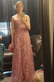 I absolutely LOVE this dress. The color and fit is beautiful. I am pictured at the seamstress wearing heels....it is a bit long, but that's an easy fix - Tracie B.