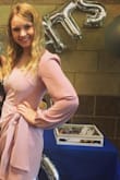 This dress is so beautiful! It's a thicker material than I thought it would be, but that is just a plus. It fits really well, but I had some trouble getting the knot perfect. - Danielle M.