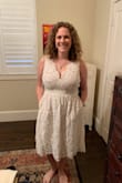 This dress is perfect for my small, backyard wedding. It fit a little tighter than I thought, but that might be because I wore a bra with it. You could try not wearing one since there's a good amount of support. The waist hits just at the right place and the length is perfect for casual but still appropriate. As I curvy woman, getting dresses comes with anxiety (especially when purchased online before trying it on), but I could not be happier with this one! The return policy is great, just in case you need something different. 
Also, it has pockets. Can't get any better than that. 
Definitely recommend. - Berkeley B.