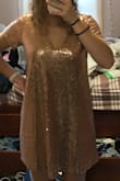 The dress is beautiful and flirty! The length is perfect and the color is gorgeous. The only complaint is the sequins are a little scratchy on the arms. - Evelyn W.
