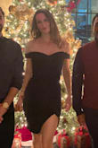 I wore this dress to a steakhouse/ cocktail Christmas party, and now I can't wait for the next occasion! The fabric is thick with a tight fit, and the shoulders have a plastic lining that keeps the dress comfortably in place. I have a long torso so the dress bunched up a bit in the back where my butt was supposed to be, and the slit comes up a bit higher than I would have liked for a work function... BUT really it is just so darn pretty. - Megan B.