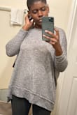The top is a little oversized but I love the fit! When I washed it, I did read that it will shred and it did around the sleeve but your can trim it with scissors and it will be like new again. Overall, it's a nice sweater. Oh, and I wore an adhesive strapless backless bra.. will wear it with a bralette next time. - Samantha F.